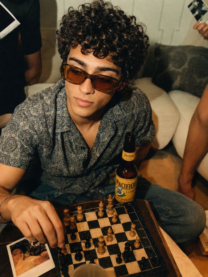 A chess game over a Pacifico at a house hang